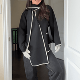 Velira Nellie | Black Wool Cape Coat with Contrast Trim Nellie | Juodas vilnos apsiaustas su kontrastingais akcentais
