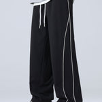 Velira Pants juoda / XS Plati Kelnės Su Šoninėmis Juostelėmis