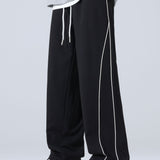 Velira Pants juoda / XS Plati Kelnės Su Šoninėmis Juostelėmis