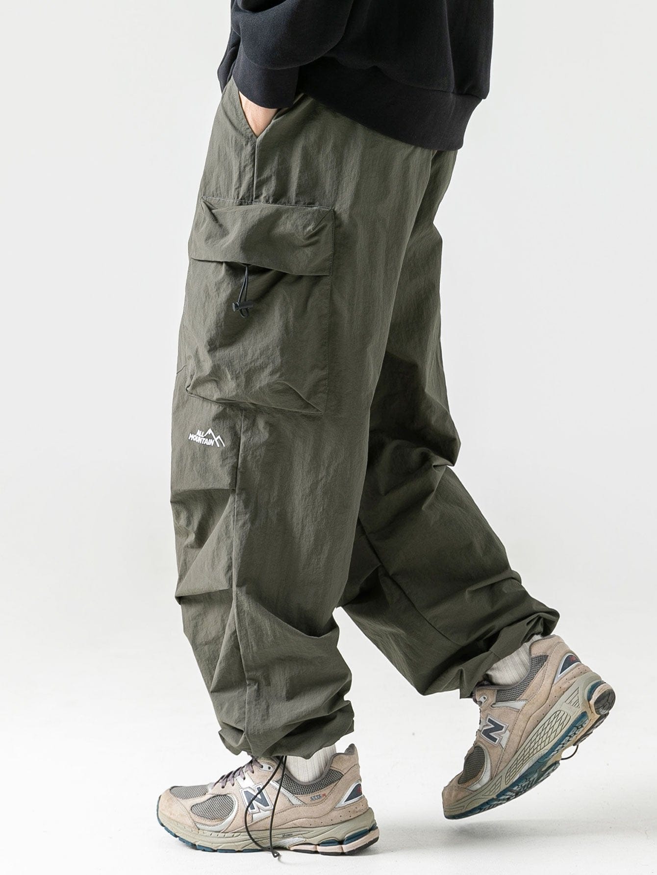 Velira Pants tamsiai žalia / S Vandeniui atsparūs parašiutiniai kelnių