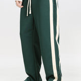 Velira Pants tamsiai žalia / XS Pantalonai su plyšiu ir juostelėmis